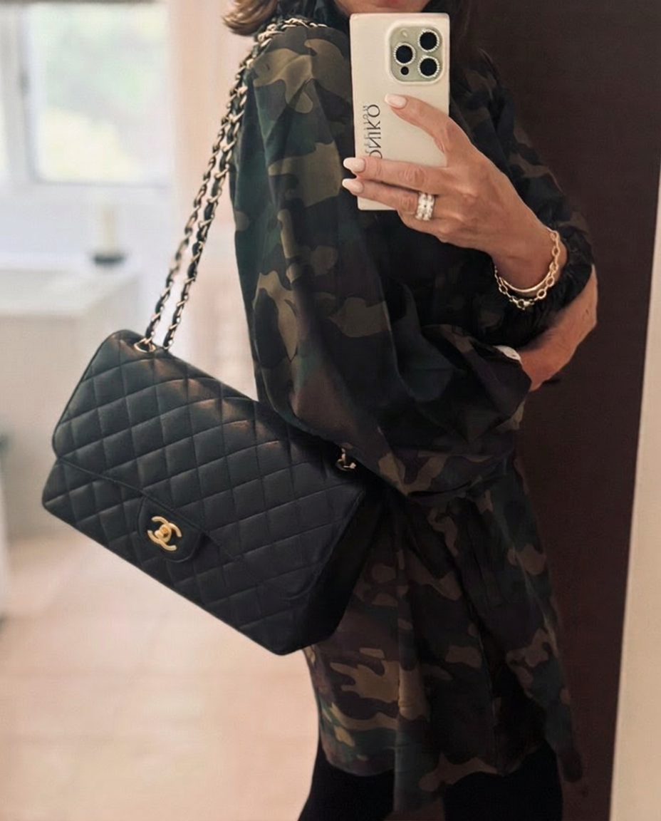 The curator, photographed with her black quilted Chanel flap and Coconiko phone case